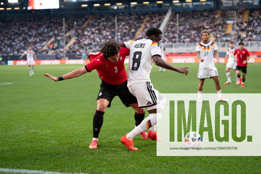 GER, Germany U21 vs. Georgia U21: A duel between Noel Aseko (Germany U21, No. 8) and Dato Bukia (Georgia U21, No. 3) at the SchücoArena in Bielefeld, Germany