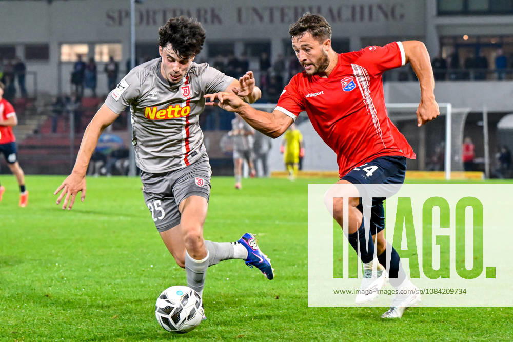 From left: Nicolas Oliveira (Regensburg), 25; Moritz Mueller (Unterhaching), 24; in a one-on-one battle, duel, tackle, dynamic play, action, October 6, 2026, Unterhaching, Germany, soccer, BFV Association Cup, quarterfinals, SpVgg Unterhaching vs. SSV Jahn Regensburg