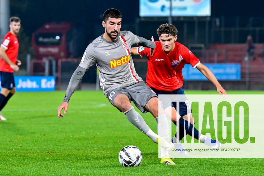 V li Nassim Boujellab Regensburg, 10 Constantin Strunz Unterhaching, 38 in a one-on-one, duel, tackle, dynamic, action, October 6, 2026, Unterhaching, Germany, soccer, BFV Association Cup, quarterfinals, SpVgg Unterhaching vs. SSV Jahn Regensburg