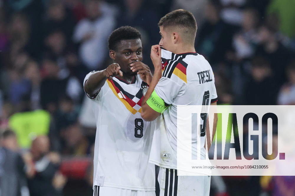 Noel Aseko (Germany) and Nicolo Tresoldi (Germany) talk during the UEFA Under-21 EURO qualifier between Germany U-21 and Georgia U-21 at Almstadion on October 6, 2026, in Bielefeld, Germany. Photo by Marco Steinbrenner, DeFodi Images