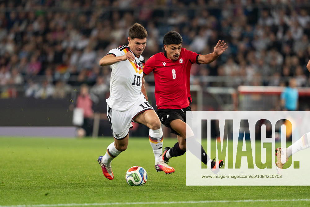 GER, Germany U21 vs. Georgia U21: A duel between Mert Kömür (Germany U21, No. 10) and Giorgi Robakidze (Georgia U21, No. 8) at the SchücoArena in Bielefeld, Germany