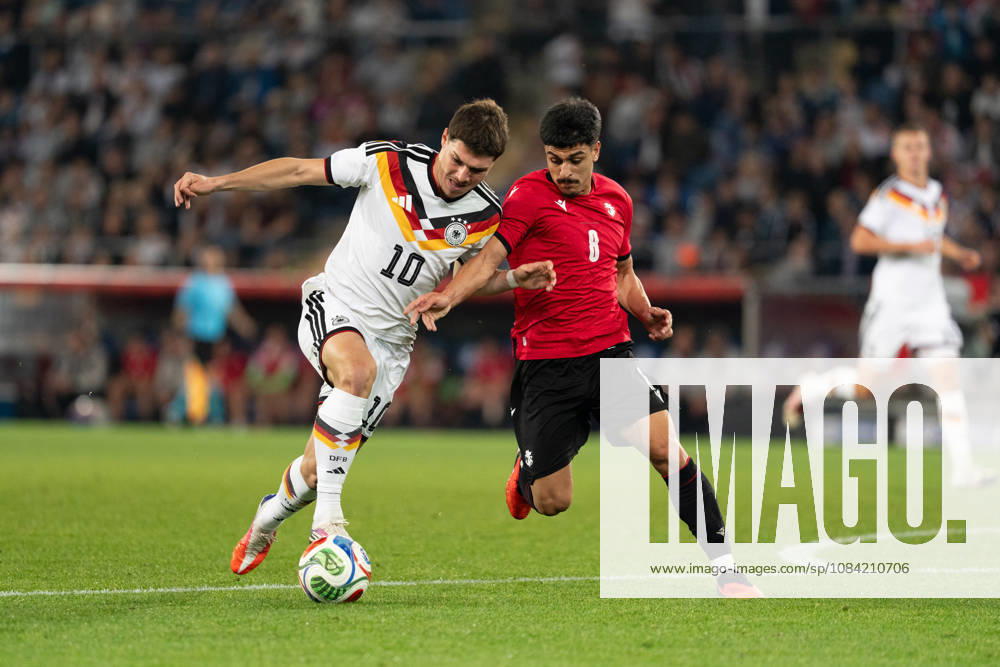 GER, Germany U21 vs. Georgia U21: A duel between Mert Kömür (Germany U21, No. 10) and Giorgi Robakidze (Georgia U21, No. 8) at the SchücoArena in Bielefeld, Germany