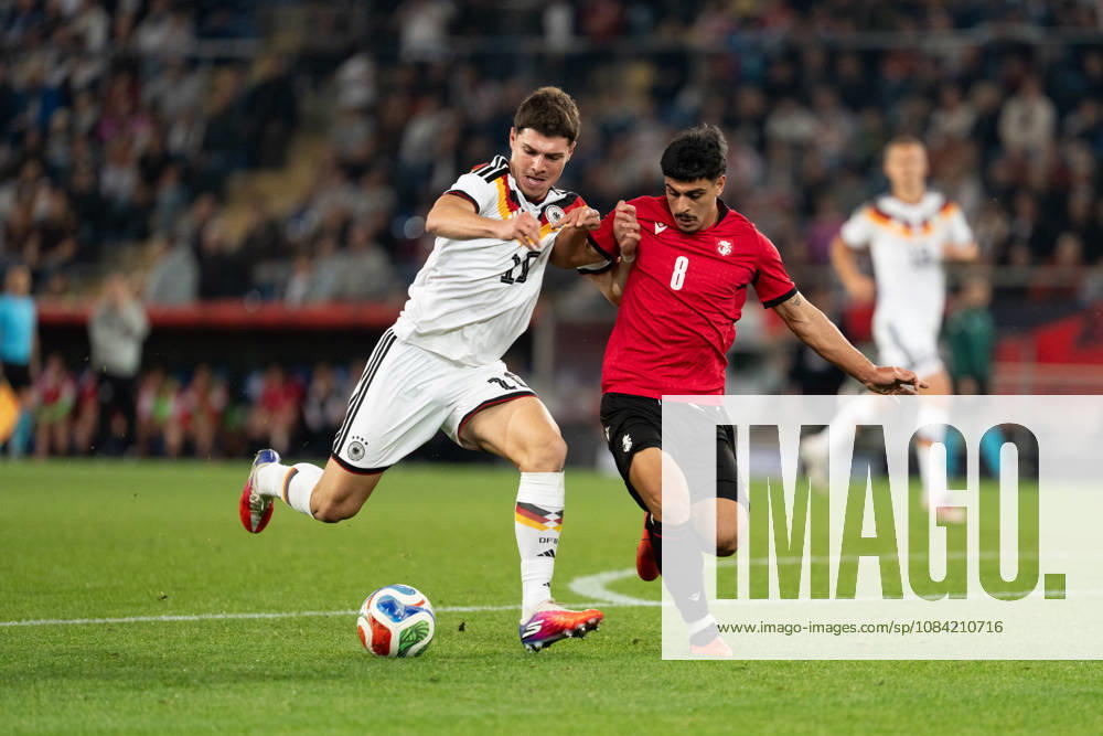 GER, Germany U21 vs. Georgia U21: A duel between Mert Kömür (Germany U21, No. 10) and Giorgi Robakidze (Georgia U21, No. 8) at the SchücoArena in Bielefeld, Germany
