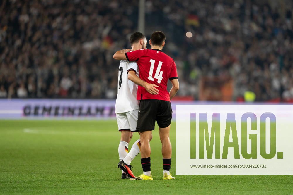 GER, Germany U21 vs. Georgia U21: Arijon Ibrahimovic (Germany U21, No. 7) and Aleko Basiladze (Georgia U21, No. 14) embrace at the SchücoArena in Bielefeld, Germany