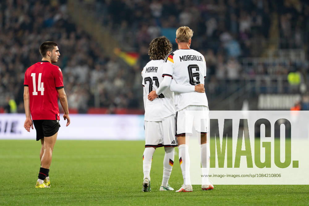 GER, Germany U21 vs. Georgia U21: Wael Mohya (Germany U21, 21) and Leandro Morgalla (Germany U21, 6) embrace at the SchücoArena in Bielefeld, Germany