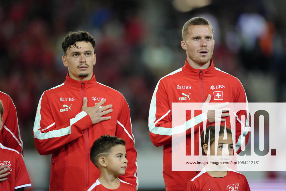 Nico Elvedi (4 SUI) and Fabian Rieder (22 SUI) during National anthem before the UEFA Nations League match between Switzerland and North Macedonia at thermoplan arena on October 06, 2026 in Luzern, Switzerland.