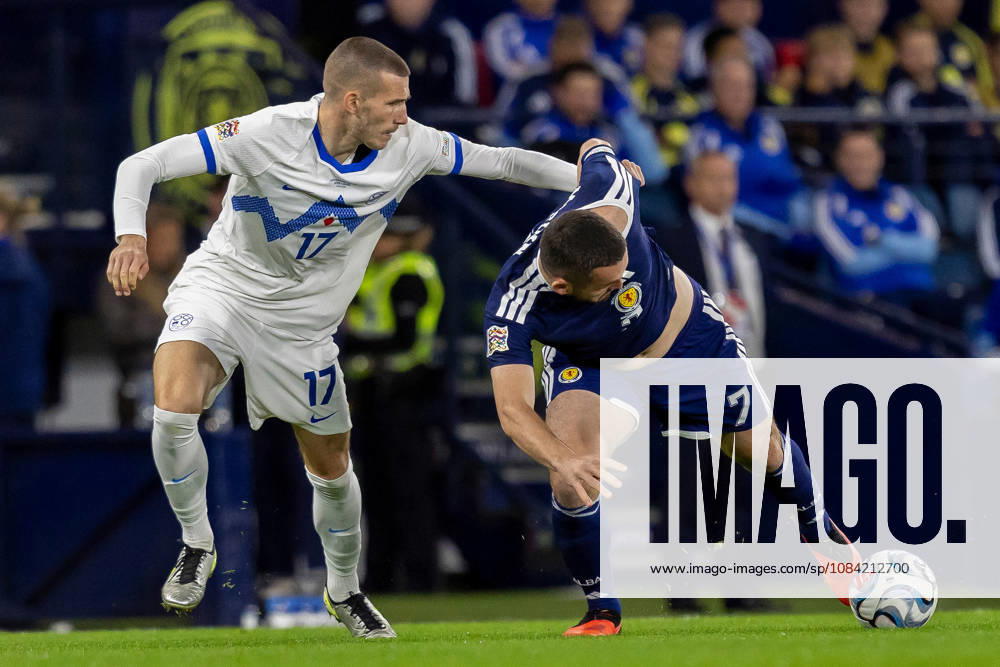 Scotland v Slovenia, UEFA Nations League John McGinn of Scotland national team, Nationalteam keeps the ball while under pressure from David Zec of Slovenia during the UEFA Nations League League B Group B1 between Scotland and Slovenia. Barclays Hampden, Hampden Park, Glasgow, Scotland. 6 October 2026. Hampden Park Barclays Hampden Glasgow Scotland Editorial use only ,