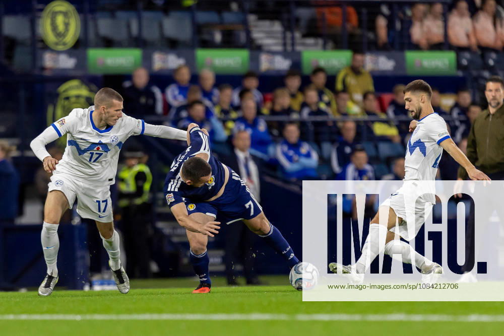 Scotland v Slovenia, UEFA Nations League John McGinn of Scotland national team, Nationalteam keeps the ball while under pressure from David Zec of Slovenia during the UEFA Nations League League B Group B1 between Scotland and Slovenia. Barclays Hampden, Hampden Park, Glasgow, Scotland. 6 October 2026. Hampden Park Barclays Hampden Glasgow Scotland Editorial use only ,