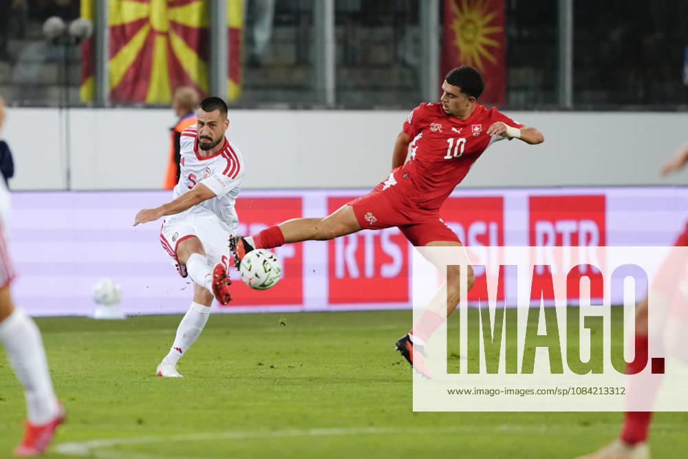 Mohamed Zeki Amdouni (10 SUI) jumps for a kick against Gjoko Zajkov (5 MKD) during the UEFA Nations League match between Switzerland and North Macedonia at thermoplan arena on October 06, 2026 in Luzern, Switzerland.