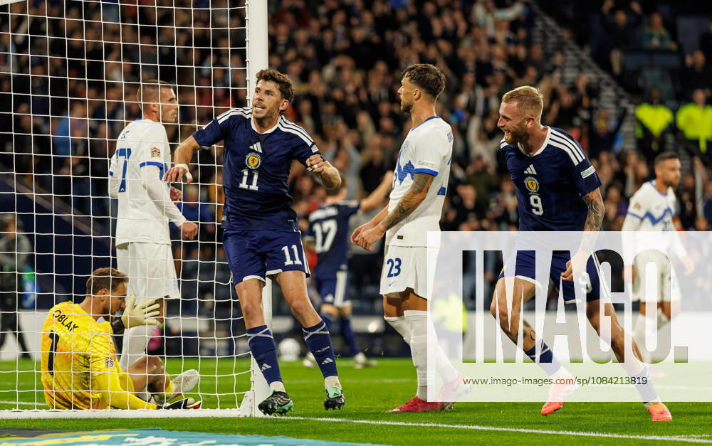 Scotland v Slovenia: Ryan Christie of Scotland scores with a backheel and celebrates