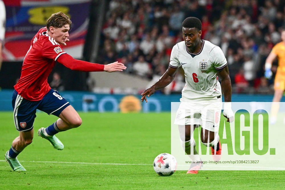 England v Czechia, UEFA Nations League England defender Marc Guehi (6) under pressure from Czechia forward Ryan Naderi (9) during the UEFA Nations League match between England and Czechia at Wembley Stadium, London, UK on 6 October 2026. London Wembley Stadium Greater London UK Editorial use only ,
