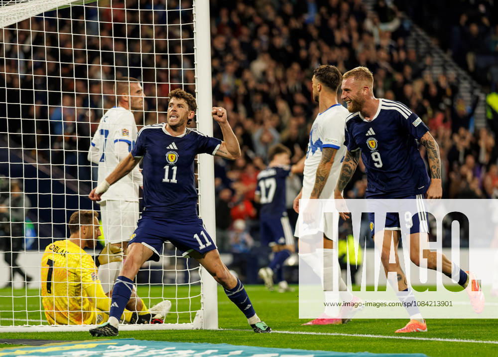 Scotland v Slovenia: Ryan Christie of Scotland scores with a backheel and celebrates