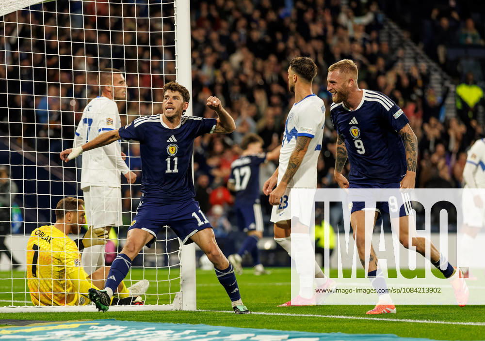 Scotland v Slovenia: Ryan Christie of Scotland scores with a backheel and celebrates