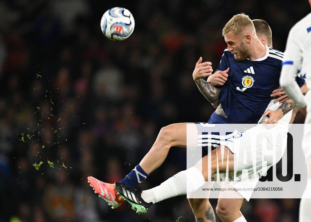 Glasgow, Scotland, 6th October 2026. Oli McBurnie of Scotland and Jaka Bijol of Slovenia during the Scotland vs Slovenia UEFA Nations League match at Hampden Park, Glasgow. Picture credit should read: Neil Hanna Sportimage . SPI_027_NH_Scotland_Slovenia SPI-5054-0028
