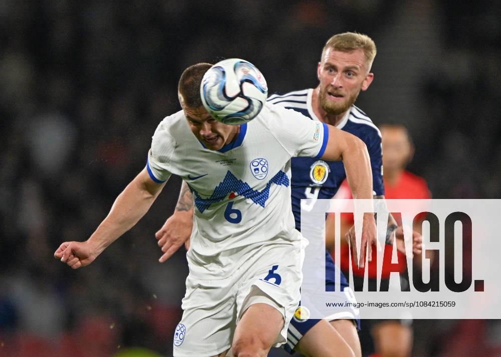 Glasgow, Scotland, 6th October 2026. Oli McBurnie of Scotland and Jaka Bijol of Slovenia during the Scotland vs Slovenia UEFA Nations League match at Hampden Park, Glasgow. Picture credit should read: Neil Hanna Sportimage . SPI_029_NH_Scotland_Slovenia SPI-5054-0029