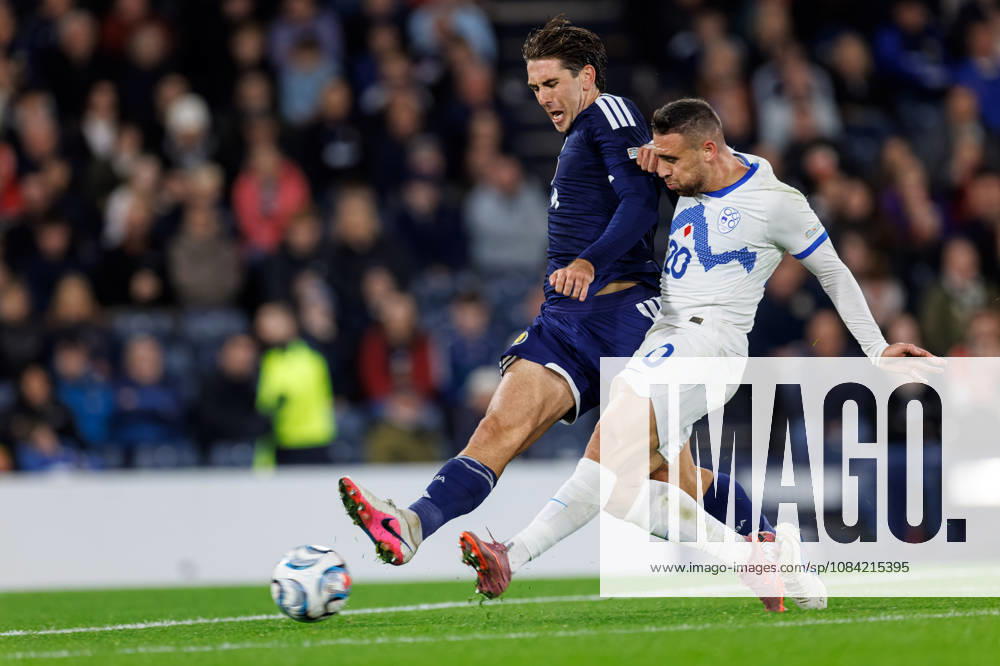 Scotland v Slovenia: Aljosa Matko of Slovenia beats the challenge of Luis Binks of Scotland to score for Slovenia