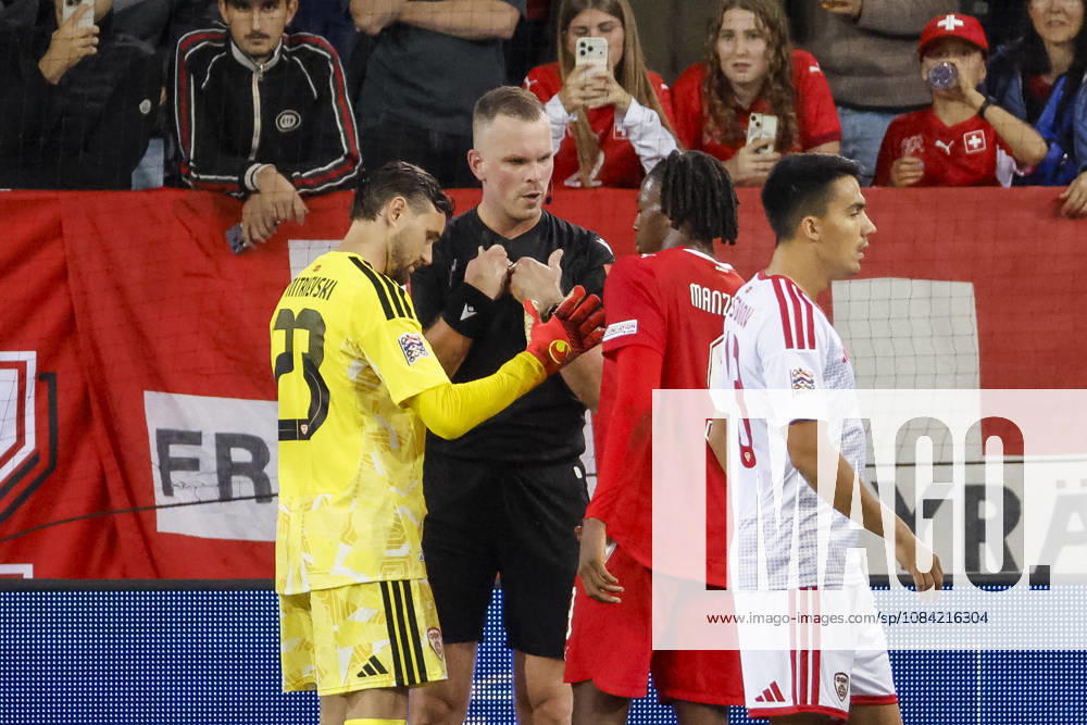 Stole Dimitrievski (North Macedonia), 23, referees Edgars Malcevs (LVA) and Johan Manzambi (Switzerland), 09—in dialogue, in conversation, exchanging ideas, communicating—Switzerland, UEFA, Nations League, Matchday 4, Switzerland vs. North Macedonia, October 6, 2026, Lucerne Swissporarena, Switzerland
