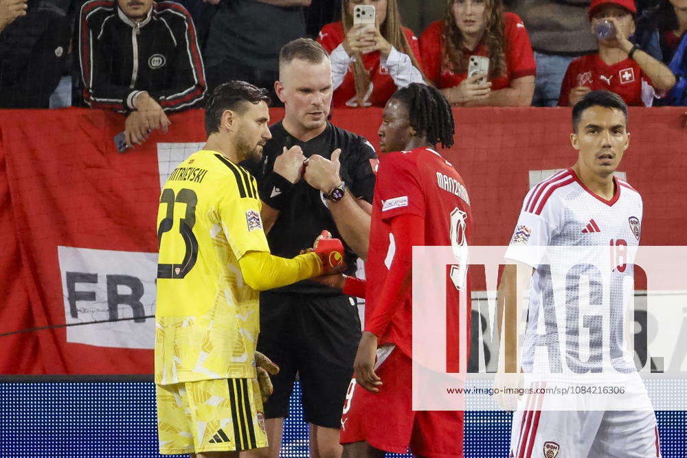 Stole Dimitrievski (North Macedonia), 23, referees Edgars Malcevs (LVA) and Johan Manzambi (Switzerland), 09—in dialogue, in conversation, exchanging ideas, communicating—Switzerland, UEFA, Nations League, Matchday 4, Switzerland vs. North Macedonia, October 6, 2026, Lucerne Swissporarena, Switzerland