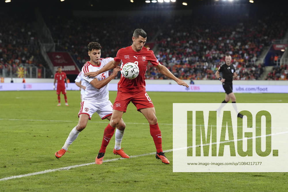 Remo Freuler (8 SUI) in duel for the ball with Agon Elezi (15 MKD) during the UEFA Nations League match between Switzerland and North Macedonia at thermoplan arena on October 06, 2026 in Luzern, Switzerland.