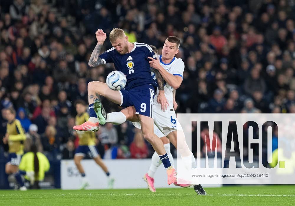 UK: Scotland v Slovenia, UEFA Nations League at Barclays Hampden, Glasgow, Scotland on 06 October 2026: Pictured: Oli McBurnie (Scotland) and Jaka Bijol (Slovenia) Glasgow Barclays Hampden Scotland