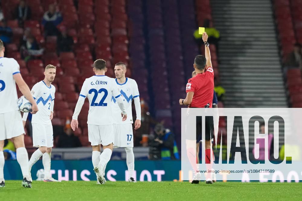 UK: Scotland v Slovenia, UEFA Nations League at Barclays Hampden, Glasgow, Scotland on 06 October 2026: Pictured: Referee Jose Maria Sanchez (ESP) shows the yellow card to David Zec (Slovenia) Glasgow Barclays Hampden Scotland