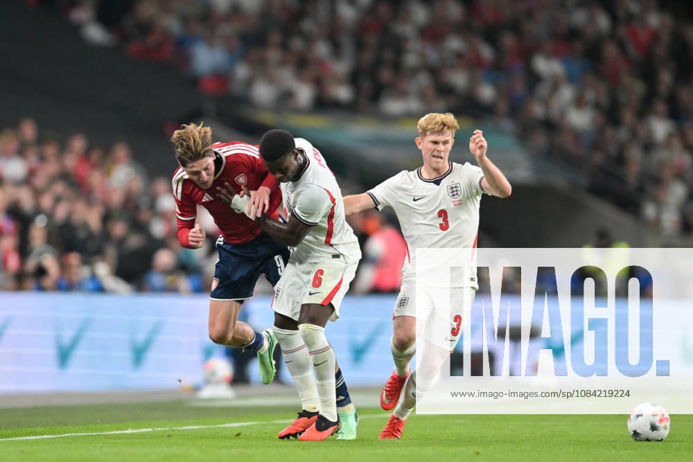 Ryan Naderi of Czechia is challenged by Marc Guehi of England as lewis Hall of England chase the ball during the Nations League match between England and Czechia at Wembley Stadium, London, England on 6 October 2026.