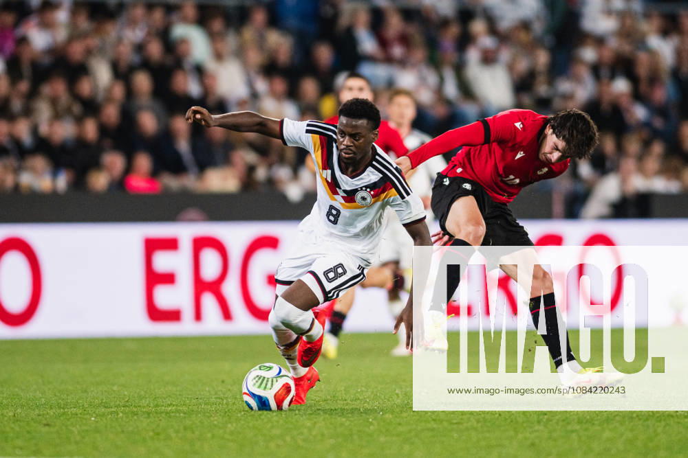 U-21 European Championship Qualifier: Germany vs. Georgia, October 6, 2026: Noel Aseko (Germany, No. 8) passes Nikoloz Dadiani (Georgia, No. 10). Soccer, U-21 European Championship Qualifiers, Matchday 10: Germany vs. Georgia on October 6, 2026, Bielefeld DFB REGULATIONS PROHIBIT ANY USE OF PHOTOGRAPHS AS IMAGE SEQUENCES AND OR QUASI-VIDEO