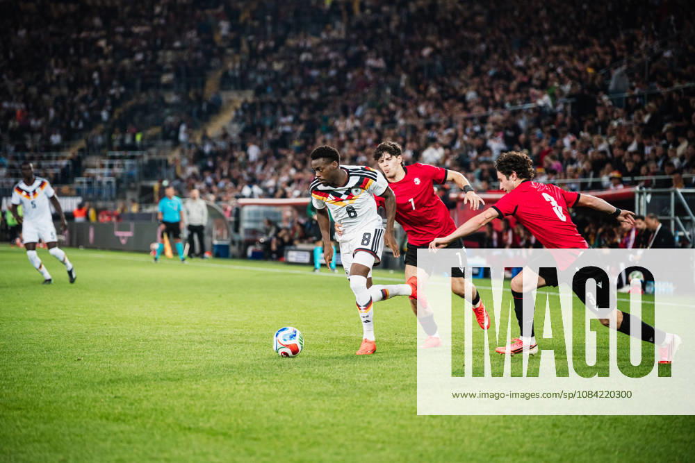 U-21 European Championship Qualifier: Germany vs. Georgia, October 6, 2026: Noel Aseko (Germany), 8, vs. Vakhtang Salia (Georgia), 7, and Dato Bukia (Georgia), 3; Soccer, U-21 European Championship Qualifiers, Matchday 10: Germany vs. Georgia on October 6, 2026, Bielefeld DFB REGULATIONS PROHIBIT ANY USE OF PHOTOGRAPHS AS IMAGE SEQUENCES AND OR QUASI-VIDEO
