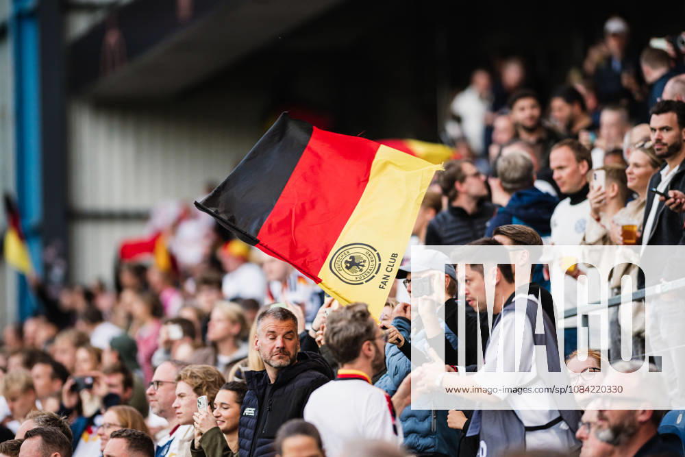 U-21 European Championship Qualifier: Germany vs. Georgia, October 6, 2026—A German flag is waved in the crowd. Soccer, U-21 European Championship Qualifier, Matchday 10: Germany vs. Georgia on October 6, 2026, Bielefeld DFB REGULATIONS PROHIBIT ANY USE OF PHOTOGRAPHS AS IMAGE SEQUENCES AND OR QUASI-VIDEO