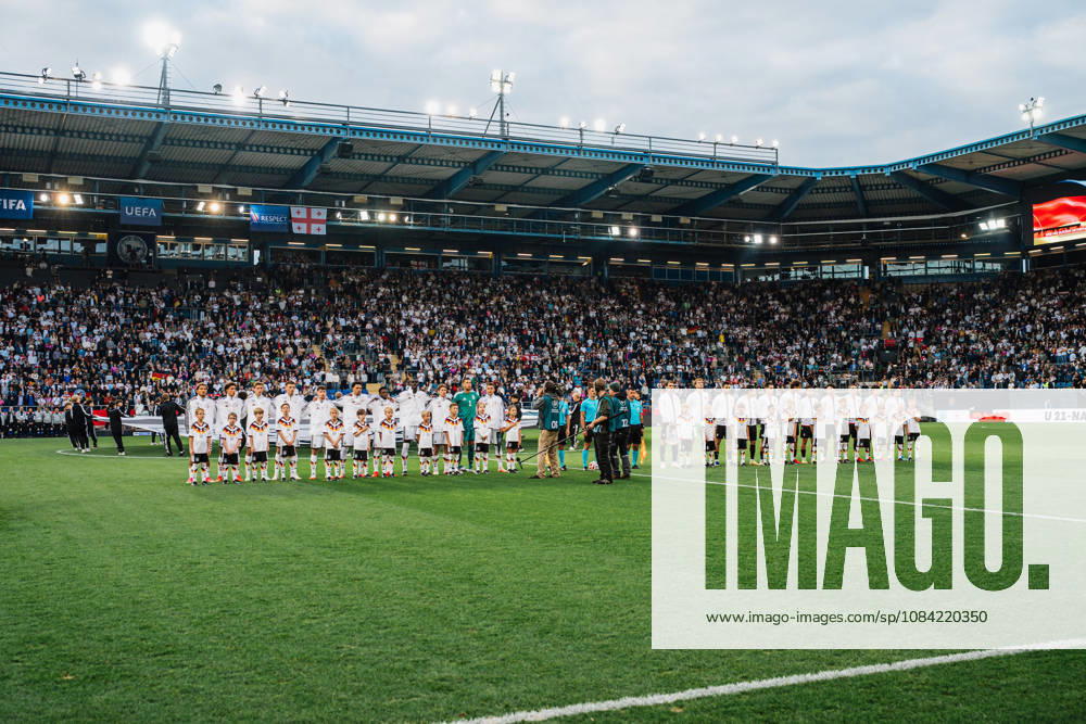 U21 European Championship Qualifier: Germany vs. Georgia, October 6, 2026; Germany during the national anthem: Paris Brunner (Germany), 19; Noah Darvich (Germany), 17; Aljoscha Kemlein (Germany), 16; Dženan Pejcinovic, Germany, 11, Nnamdi Collins, Germany, 20, Noel Aseko, Germany, 8, Joshua Quarshie, Germany, 5, Lukas Ullrich, Germany, 3, Elias Baum, Germany, 2, Mio Backhaus, Germany, 1, Nicolò Tresoldi Germany, 9 with Georgia, Papuna Beruashvili Georgia, 23, Dato Bukia Georgia, 3, Aleksandre Narimanidze Georgia, 4, Aleksandre Amisulashvili (Georgia), 5, Dachi Lordkipanidze (Georgia), 6, Vakhtang Salia (Georgia), 7, Diego Deisadze (Georgia), 9, Nikoloz Dadiani (Georgia), 10, Halid Doltmourziev (Georgia), 13, Aleko Basiladze (Georgia), 14, Akaki Giunashvili (Georgia), 17 Soccer, U-21 European Championship Qualifiers, Matchday 10: Germany vs. Georgia on October 6, 2026, Bielefeld DFB REGULATIONS PROHIBIT ANY USE OF PHOTOGRAPHS AS IMAGE SEQUENCES AND OR QUASI-VIDEO