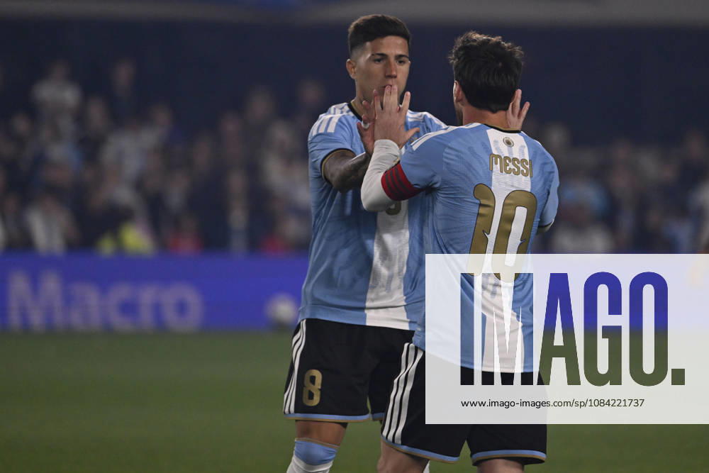BUENOS AIRES, ARGENTINA - OCTOBER 06 : Forward Lionel Messi 10 of Argentina high-fives teammate Enzo Fernandez 8 during an International Friendly, Länderspiel, Nationalmannschaft match against Benin at Estadio Monumental on October 06, 2026 in Buenos Aires, Argentina. This historic match marks the final international appearance who wore a commemorative special-edition kit replacing the traditional manufacturer branding with his personal signature logo. Photo by SFSI Argentina national team, Nationalteam v Benin