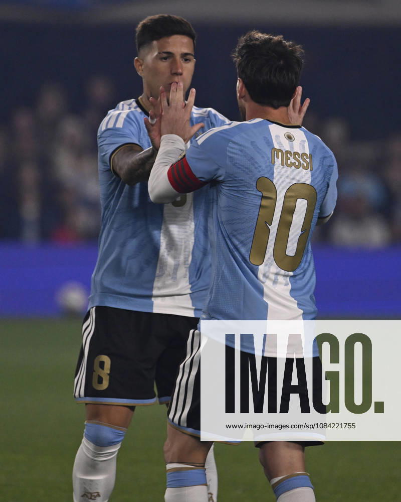 BUENOS AIRES, ARGENTINA - OCTOBER 06 : Forward Lionel Messi 10 of Argentina high-fives teammate Enzo Fernandez 8 during an International Friendly, Länderspiel, Nationalmannschaft match against Benin at Estadio Monumental on October 06, 2026 in Buenos Aires, Argentina. This historic match marks the final international appearance who wore a commemorative special-edition kit replacing the traditional manufacturer branding with his personal signature logo. Photo by SFSI Argentina national team, Nationalteam v Benin