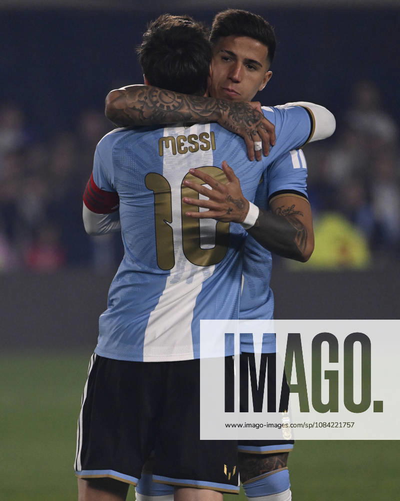 BUENOS AIRES, ARGENTINA - OCTOBER 06 : Forward Lionel Messi 10 of Argentina high-fives teammate Enzo Fernandez 8 during an International Friendly, Länderspiel, Nationalmannschaft match against Benin at Estadio Monumental on October 06, 2026 in Buenos Aires, Argentina. This historic match marks the final international appearance who wore a commemorative special-edition kit replacing the traditional manufacturer branding with his personal signature logo. Photo by SFSI Argentina national team, Nationalteam v Benin