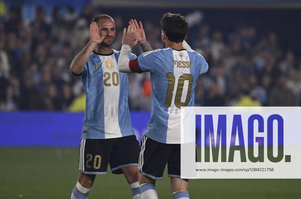 BUENOS AIRES, ARGENTINA - OCTOBER 06 : Forward Lionel Messi 10 of Argentina high-fives teammate Alexis Mac Allister 20 during an International Friendly, Länderspiel, Nationalmannschaft match against Benin at Estadio Monumental on October 06, 2026 in Buenos Aires, Argentina. This historic match marks the final international appearance who wore a commemorative special-edition kit replacing the traditional manufacturer branding with his personal signature logo. Photo by SFSI Argentina national team, Nationalteam v Benin