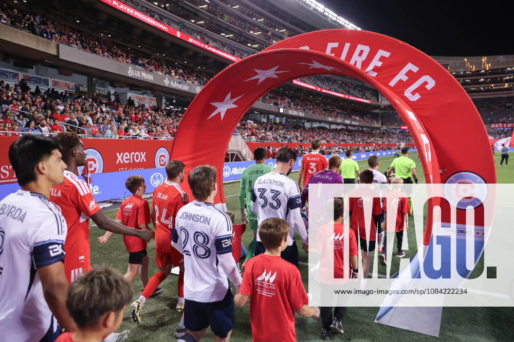 Chicago Fire FC and Vancouver Whitecaps FC players walk onto the pitch before the Major League Soccer game between Chicago Fire FC and Vancouver Whitecaps FC at Soldier Field on Tuesday October 6 in Chicago, USA