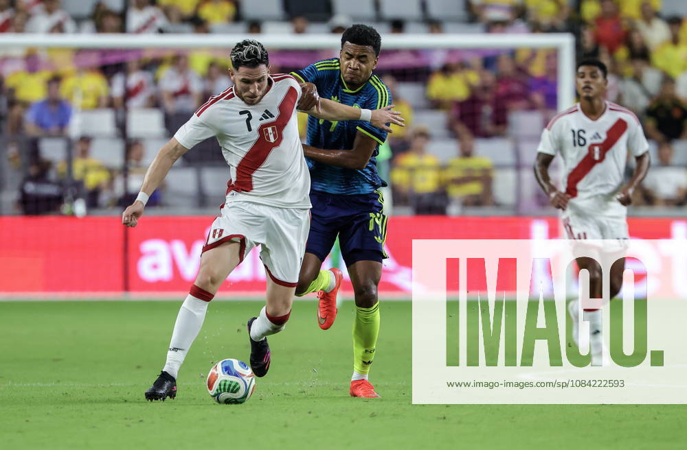 International soccer friendly - Colombia vs. Peru Peru forward Adrian Ugarriza (L) in action against Colombia midfielder Jhon Solis (C) during the international soccer friendly between Colombia and Peru at Nu Stadium in Miami, Florida, USA, 06 October 2026. MIAMI FLORIDA United States