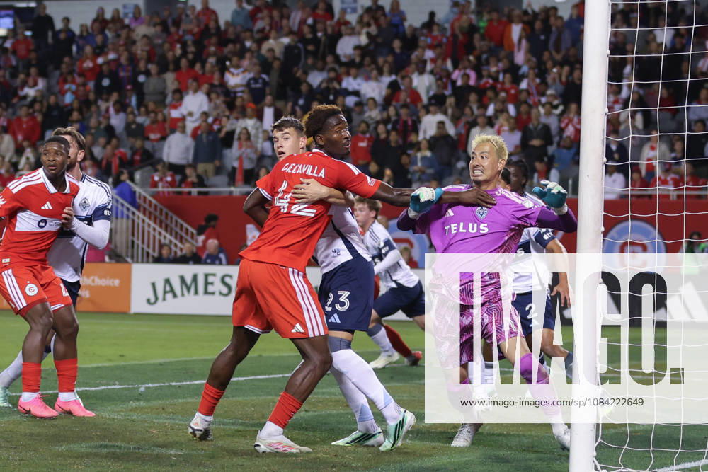 Dje D’Avilla (42 Chicago Fire FC) impedes Yohei Takaoka (1 Vancouver Whitecaps FC) during the Major League Soccer game between Chicago Fire FC and Vancouver Whitecaps FC at Soldier Field on Tuesday October 6 in Chicago, USA