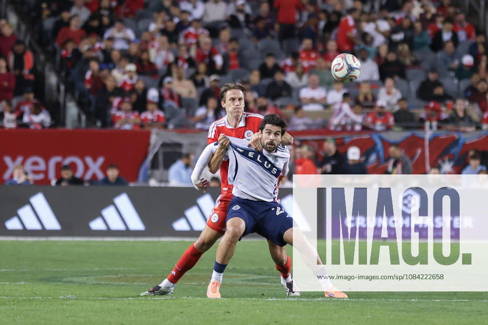 Jack Elliott (3 Chicago Fire FC) grabs onto Brian White (24 Vancouver Whitecaps FC) during the Major League Soccer game between Chicago Fire FC and Vancouver Whitecaps FC at Soldier Field on Tuesday October 6 in Chicago, USA