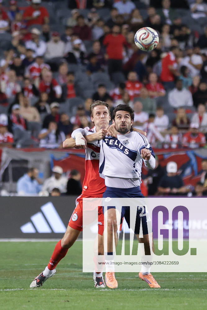 Jack Elliott (3 Chicago Fire FC) grabs onto Brian White (24 Vancouver Whitecaps FC) during the Major League Soccer game between Chicago Fire FC and Vancouver Whitecaps FC at Soldier Field on Tuesday October 6 in Chicago, USA