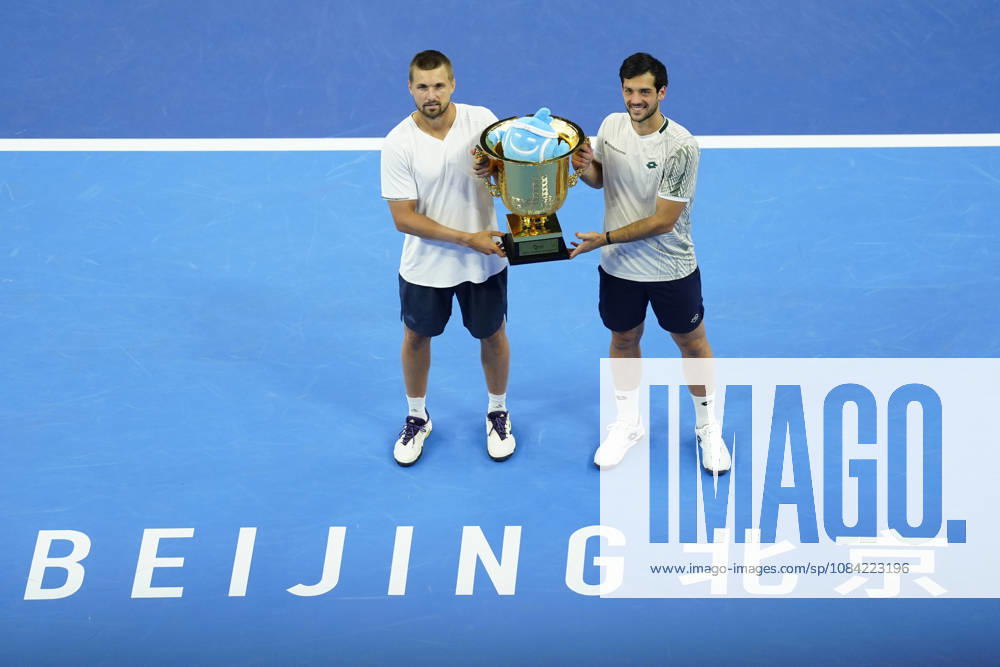 Julian Cash and Lloyd Glasspool of Great Britain pose with their winner s trophy during the medal ceremony after winning against Sander Arends and David Pel of Netherlands (not in view) during the Men s Doubles final match on day seven of China Open at the National Tennis Center. Julian Cash and Lloyd Glasspool won, Final Score: 6-3, 3-6, 10-6 Beijing China - ZUMAs197 20261006_aaa_s197_258
