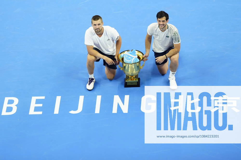 Julian Cash and Lloyd Glasspool of Great Britain pose with their winner s trophy during the medal ceremony after winning against Sander Arends and David Pel of Netherlands (not in view) during the Men s Doubles final match on day seven of China Open at the National Tennis Center. Julian Cash and Lloyd Glasspool won, Final Score: 6-3, 3-6, 10-6 2026 China Open In Beijing - 06 Oct 2026 - ZUMAs197 20261006_aaa_s197_256