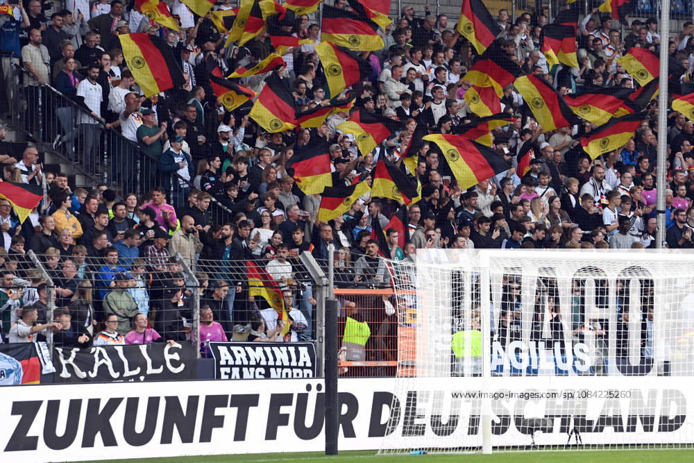 German fans with their flags, feature, background image, symbolic photo, international soccer match, U21, European Championship qualifier, Germany vs. Georgia 2–0 on October 6, 2026, Schüco Arena, Bielefeld, Â