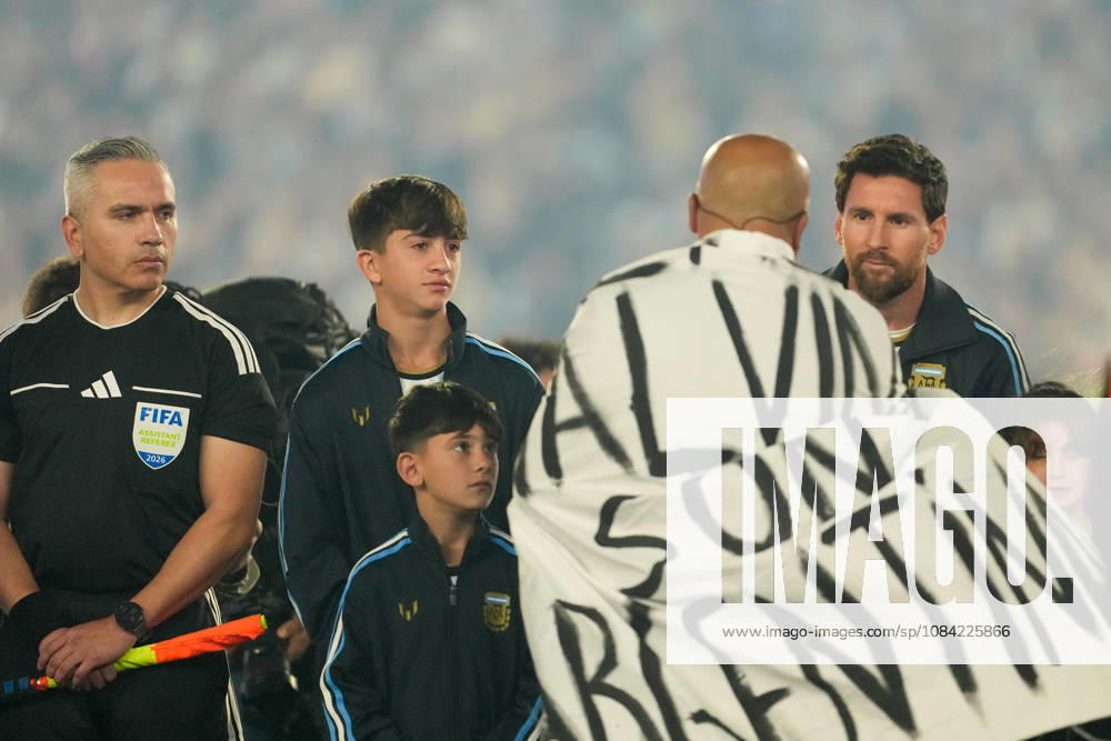 BUENOS AIRES, ARGENTINA 6 OCTOBER: Lionel Messi, an Argentine footballer, is greeted by Fabio Santana, a veteran of the 1982 Falklands War, who sang the Argentine national anthem during a friendly match between Argentina and Benin at the Estadio Monumental Antonio V. Liberti on 6 October 2026 in Buenos Aires, Argentina.
