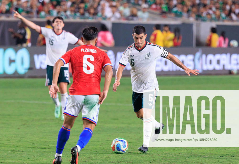 Erik Lira 6 of Mexico passes the ball over Vicente Pizarro 6 of Chile during an International Friendly, Länderspiel, Nationalmannschaft match at Los Angeles Memorial Coliseum on Tuesday, October 6, 2026, in Los Angeles, California. Mexico loses to Chile, 0-2. JAVIER ROJAS PI Mexico Vs. Peru - ZUMAp124 20261006_zaa_p124_145