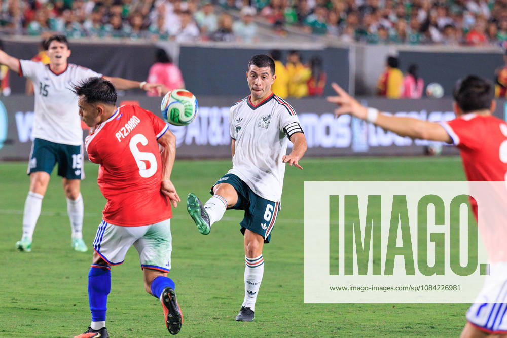 Erik Lira 6 of Mexico passes the ball over Vicente Pizarro 6 of Chile during an International Friendly, Länderspiel, Nationalmannschaft match at Los Angeles Memorial Coliseum on Tuesday, October 6, 2026, in Los Angeles, California. Mexico loses to Chile, 0-2. JAVIER ROJAS PI Mexico Vs. Peru - ZUMAp124 20261006_zaa_p124_146