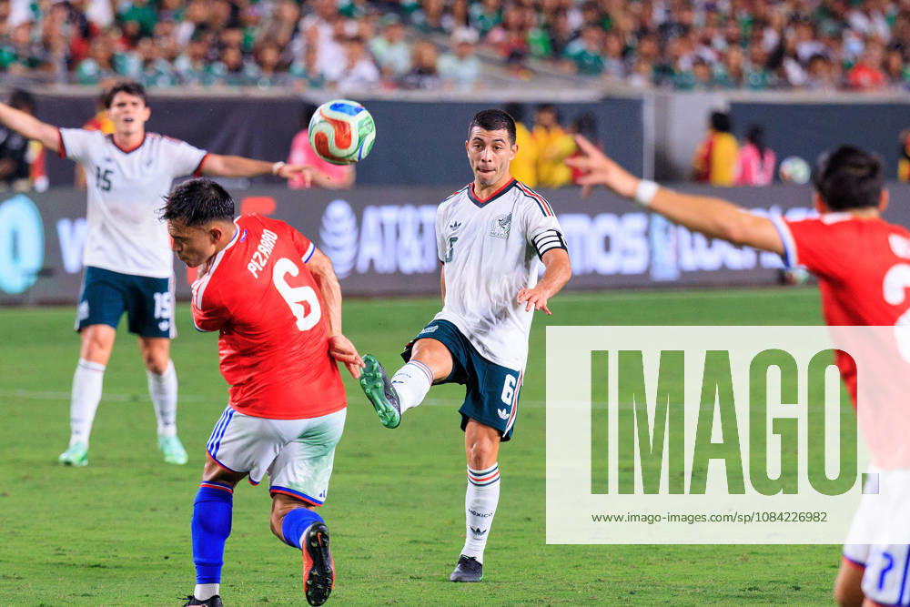 Erik Lira 6 of Mexico passes the ball over Vicente Pizarro 6 of Chile during an International Friendly, Länderspiel, Nationalmannschaft match at Los Angeles Memorial Coliseum on Tuesday, October 6, 2026, in Los Angeles, California. Mexico loses to Chile, 0-2. JAVIER ROJAS PI Mexico Vs. Peru - ZUMAp124 20261006_zaa_p124_147