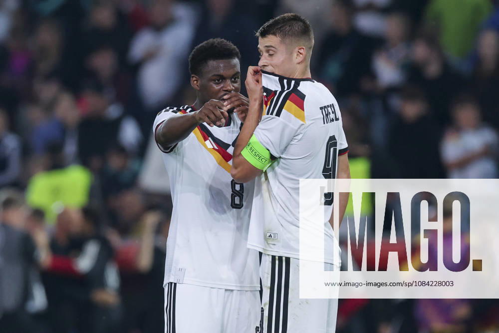 Noel Aseko (Germany) and Nicolo Tresoldi (Germany) talk during the UEFA Under-21 EURO qualifier between Germany U21 and Georgia U21 at Almstadion on October 6, 2026, in Bielefeld, Germany. Photo by Marco Steinbrenner, DeFodi Images
