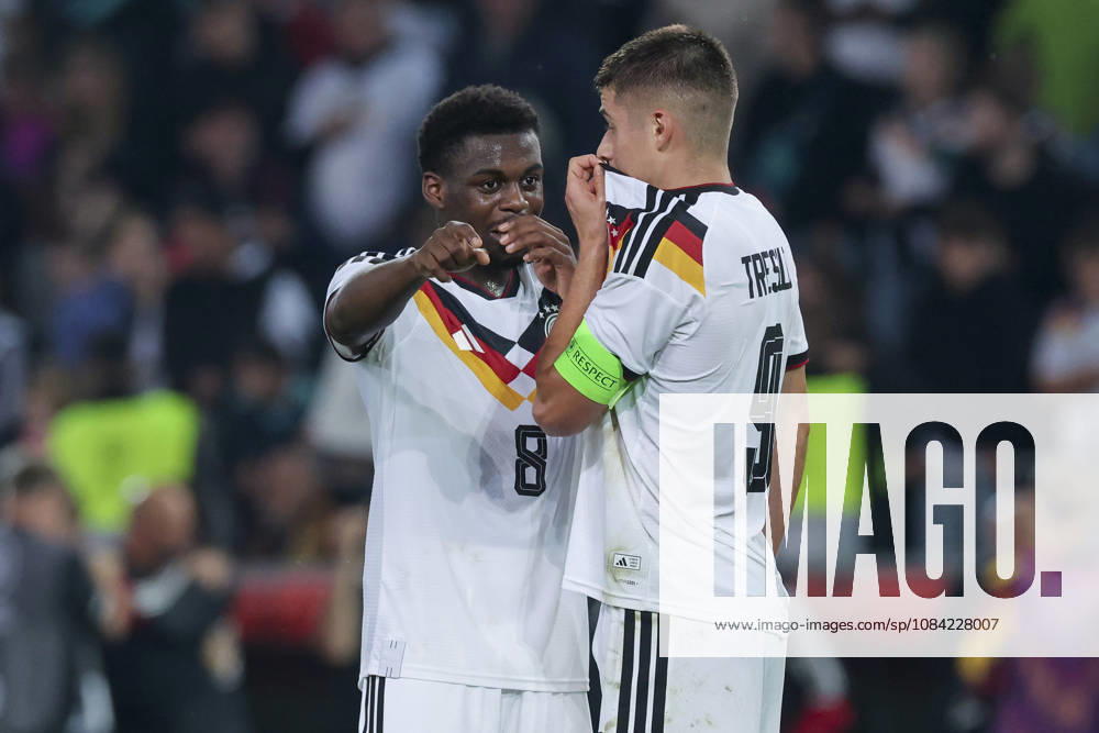Noel Aseko (Germany) and Nicolo Tresoldi (Germany) talk during the UEFA Under-21 EURO qualifier between Germany U21 and Georgia U21 at Almstadion on October 6, 2026, in Bielefeld, Germany. Photo by Marco Steinbrenner, DeFodi Images
