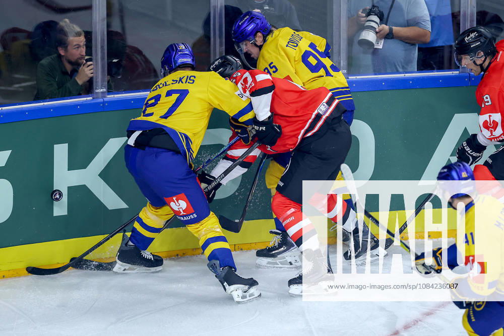 Ice Hockey, CHL, Kölner Haie vs. Blue Fox Herning, Champions Hockey League 2026–27, Matchday 5, 2026–27 Season, Lanxess Arena, Cologne: Marco Münzenberger of the Kölner Haie 65 battles Oskars Cibulskis of Blue Fox Herning 27 and Artturi Mikael Toivola of Blue Fox Herning 95; North Rhine-Westphalia, Germany