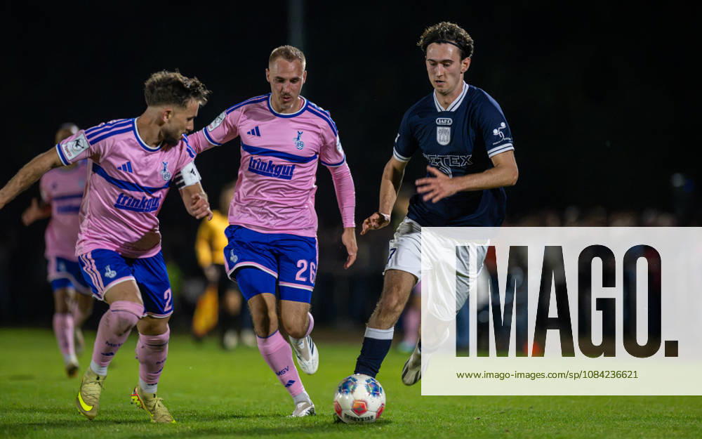 Soccer, 2026–2027 Season, Lower Rhine Cup, October 7, 2026, Round 3, Men’s, BW Dingden Blue vs. MSV Duisburg Pink; from left: Can Coskun (MSV Duisburg), Florian Krueger (MSV Duisburg), Max Mahn (BW Dingden); Hamminkeln Sports Field, BW Dingden, North Rhine-Westphalia, Germany 261007_fb_bw-dingden_msv-duisburg_61286